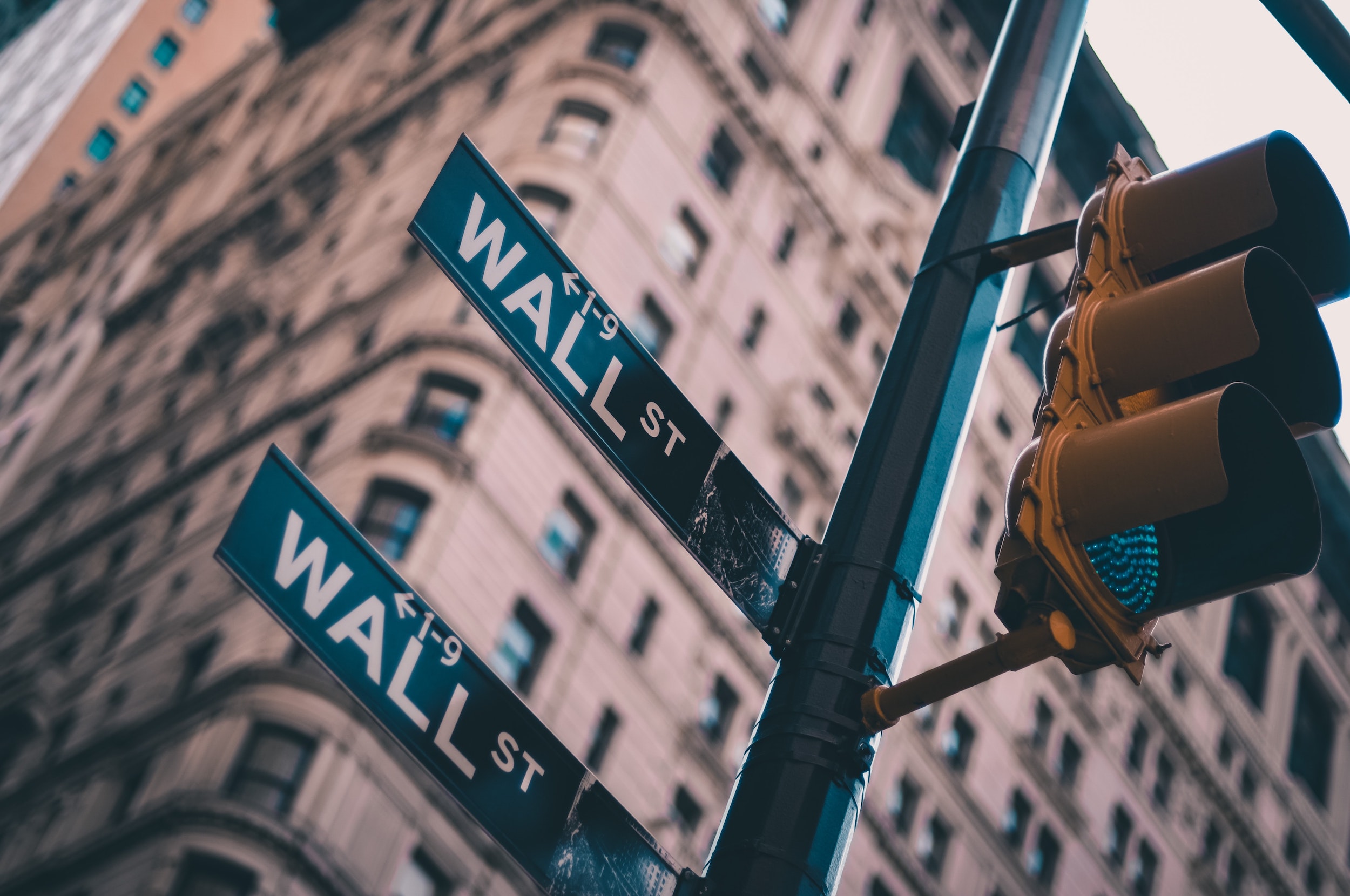 sign pointing to wall street, new york