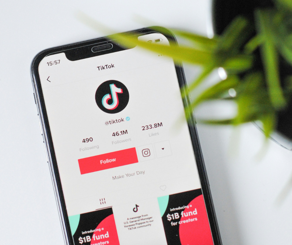 a mobile phone placed face up on a table, showing tiktok's profile page